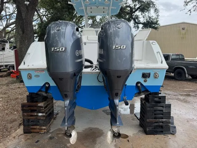 Slide: The Image of 2016 Sea Hunt Gamefish 27 with twin Yamaha 150 outboard motors on a trailer. - 6