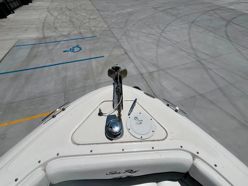 Slide: The Image of Bow of 2007 Sea Ray 290 SLX boat in a parking area with visible anchor. - 16
