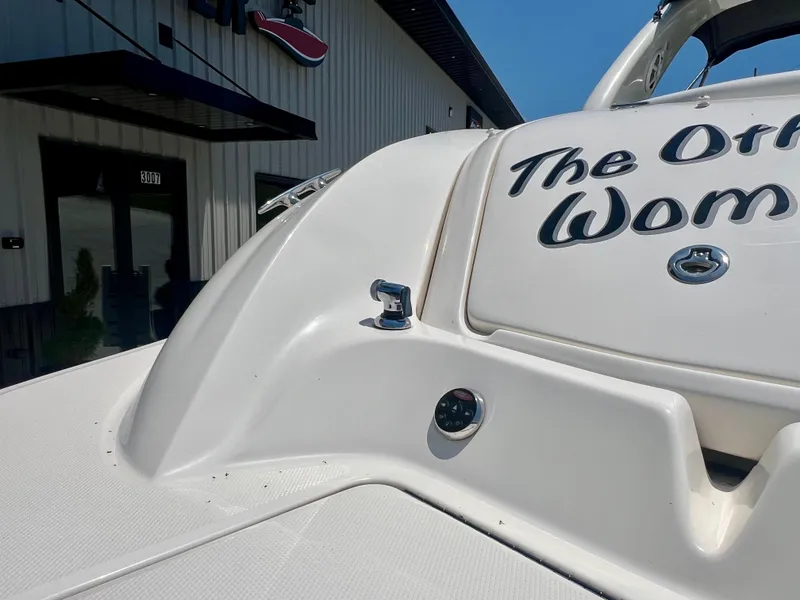 Slide: The Image of 2007 Sea Ray 290 SLX boat with custom name, docked near a building. - 20
