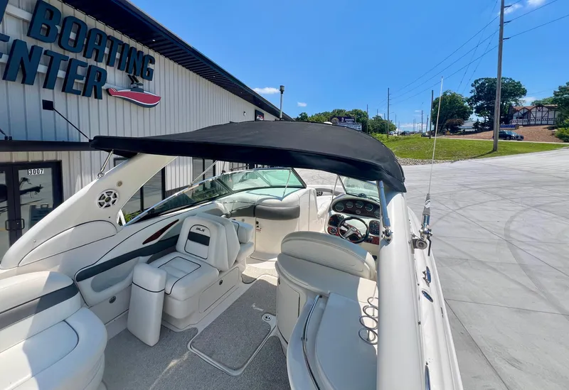 Slide: The Image of 2007 Sea Ray 290 SLX boat at a boating center, featuring spacious seating and sleek design. - 21
