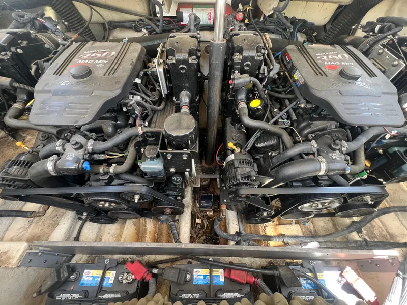 Slide: The Image of Twin MerCruiser engines in a 2007 Sea Ray 290 SLX boat engine compartment. - 25