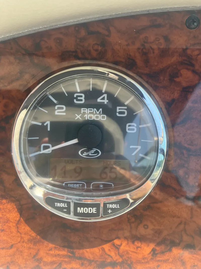 Slide: The Image of Tachometer of 2007 Sea Ray 290 SLX boat, showing RPM and control buttons. - 26