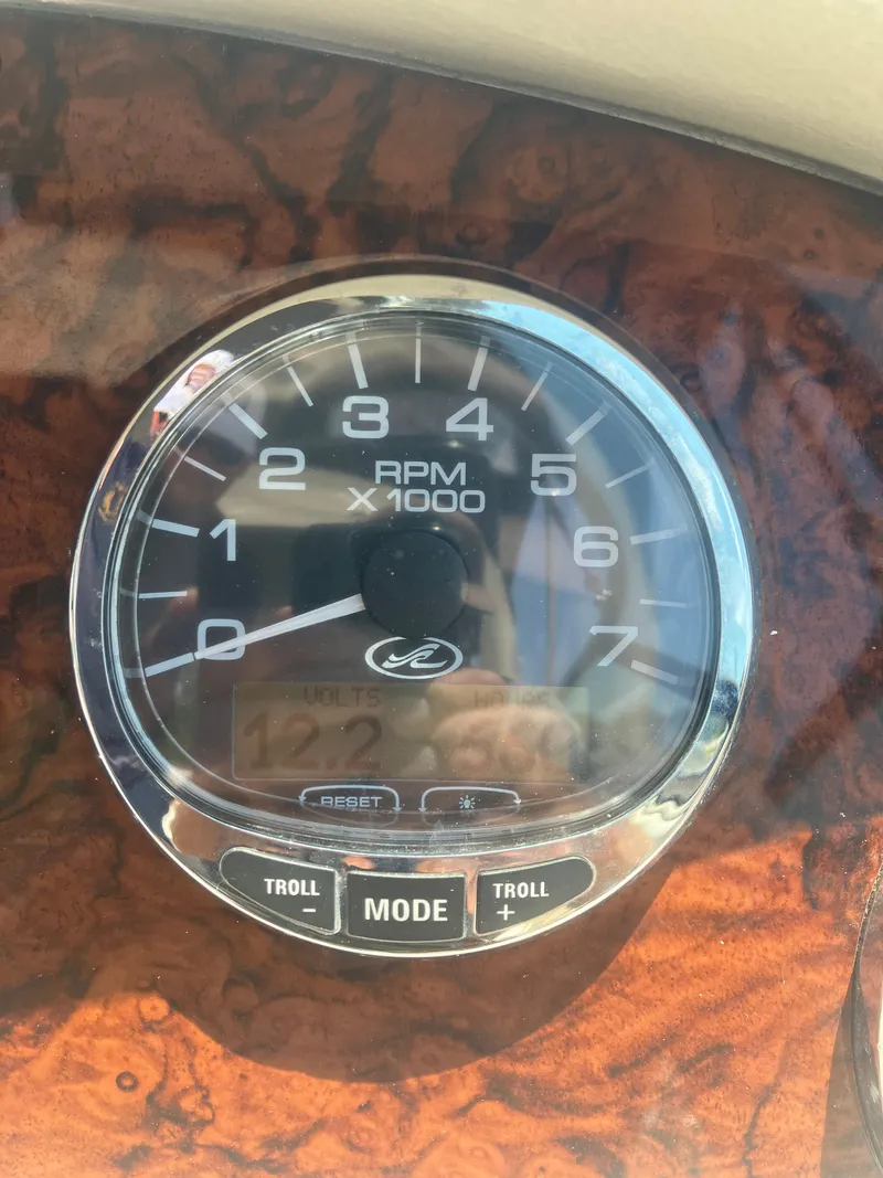 Slide: The Image of Close-up of 2007 Sea Ray 290 SLX tachometer displaying RPM and voltage. - 27