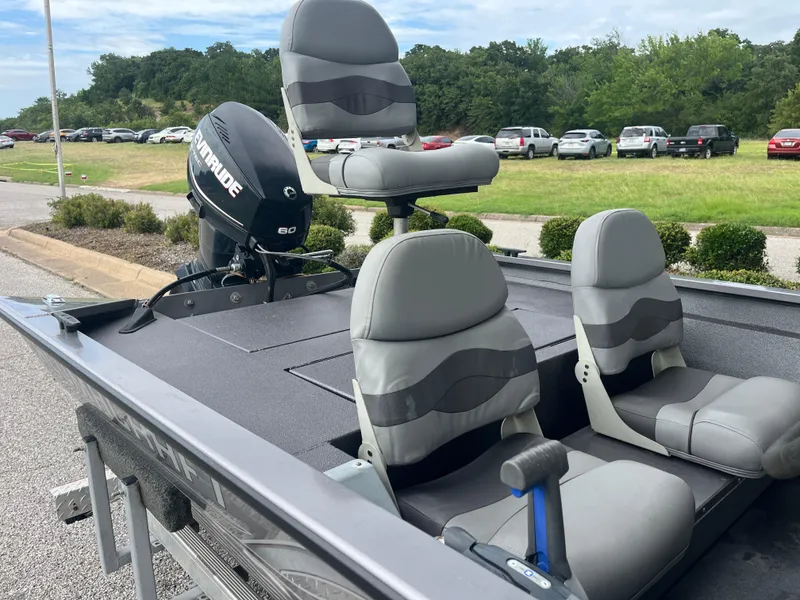 Slide: The Image of 2012 Alumacraft Pro 165 boat with Evinrude 60 engine, parked outdoors. - 32