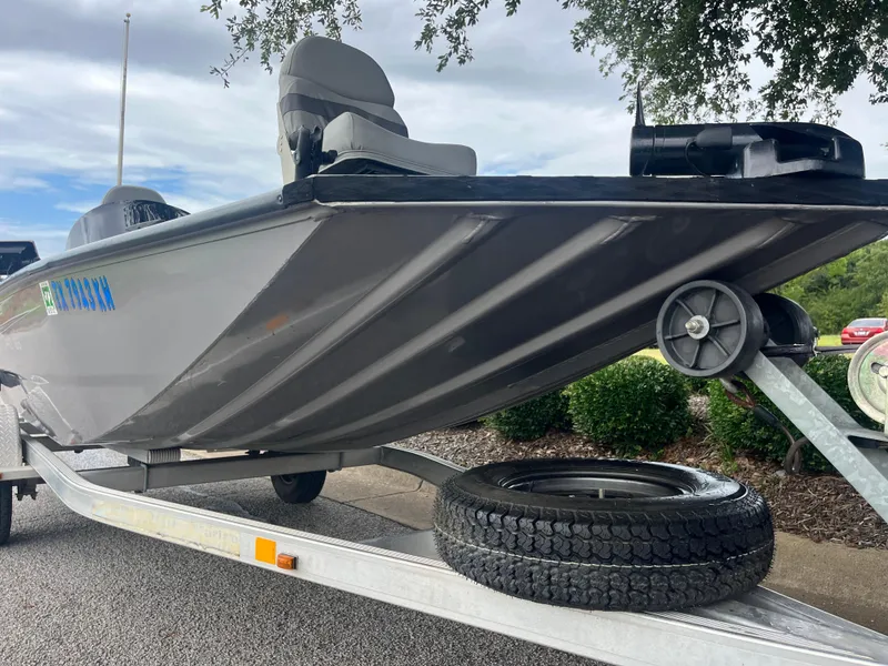 Slide: The Image of 2012 Alumacraft Pro 165 boat on trailer, gray hull, parked outdoors. - 37