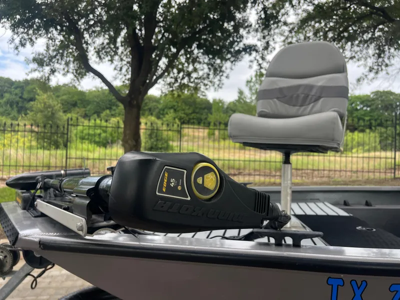 Slide: The Image of 2012 Alumacraft Pro 165 boat with trolling motor and swivel seat, set against a scenic backdrop. - 5