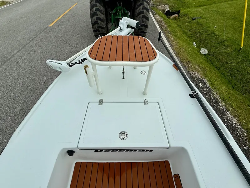 Slide: The Image of 2014 Bossman TailSpotter boat on trailer, wooden deck, roadside view. - 13