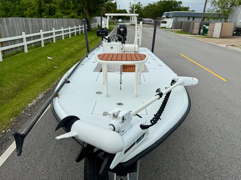 Slide: The Image of 2014 Bossman TailSpotter boat on trailer, parked on a residential street. - 6