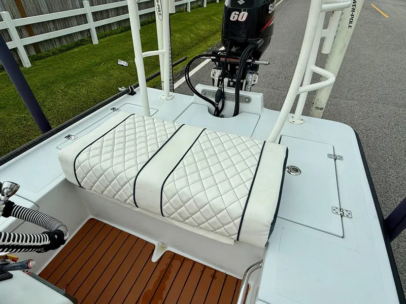 Slide: The Image of 2014 Bossman TailSpotter boat with quilted seats and Suzuki 60 outboard motor. - 8