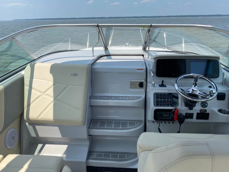 Slide: The Image of 2022 Regal 26 XO boat bathroom with shower, sink, and modern fixtures. - 7