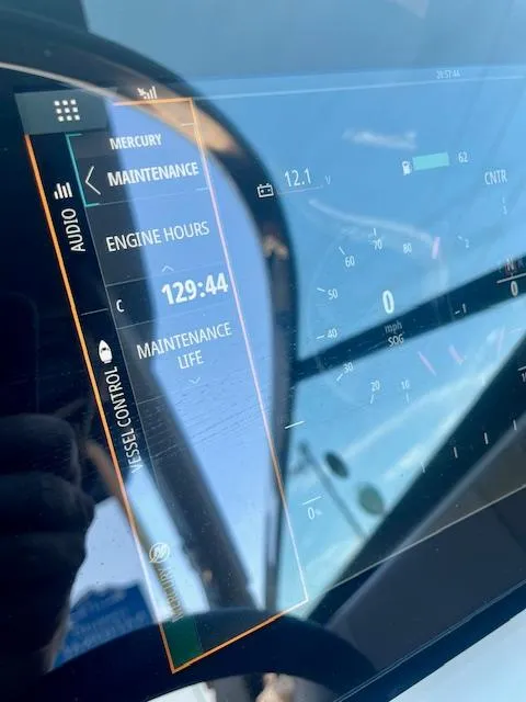 Slide: The Image of Dashboard of a 2020 Sea Ray SLX 250 showing maintenance and engine hours. - 11