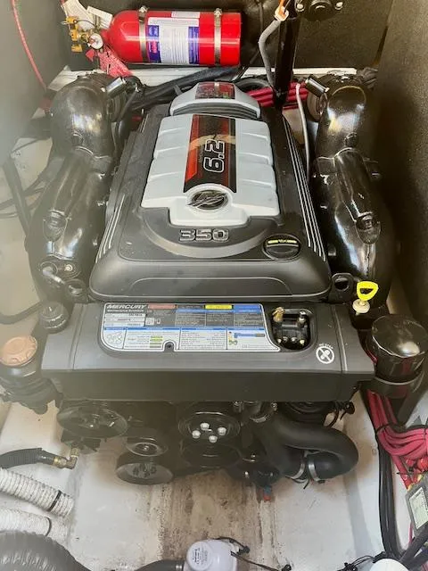 Slide: The Image of Engine compartment of a 2020 Sea Ray SLX 250 boat with visible fire extinguisher. - 12
