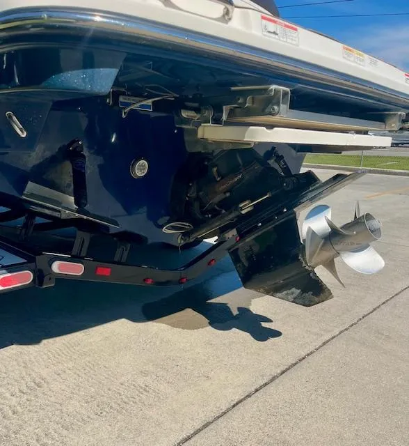 Slide: The Image of Rear view of a 2020 Sea Ray SLX 250 boat on a trailer, showcasing the propeller. - 15