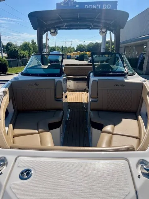 Slide: The Image of 2020 Sea Ray SLX 250 boat interior with tan seating and open deck. - 5