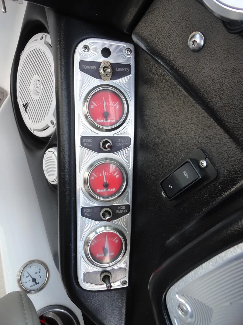 Slide: The Image of 2006 MasterCraft X-45 dashboard with ballast gauges and control switches. - 10