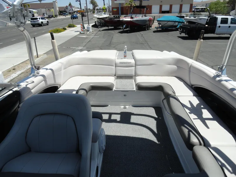 Slide: The Image of 2006 MasterCraft X-45 boat interior with white seating and gray carpet. - 22