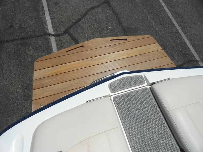 Slide: The Image of 2006 MasterCraft X-45 boat with teak swim platform and cushioned seating. - 23