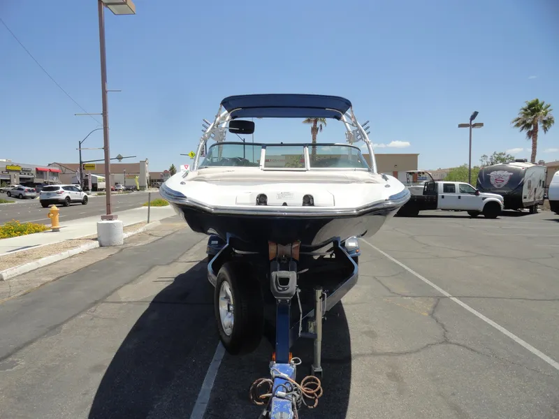 Slide: The Image of 2006 MasterCraft X-45 boat on trailer in parking lot, sunny day. - 3