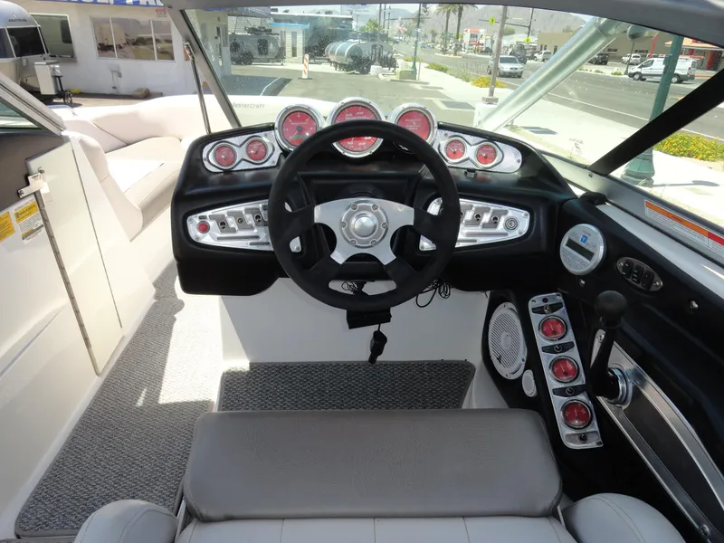 Slide: The Image of 2006 MasterCraft X-45 boat dashboard with steering wheel and gauges. - 8