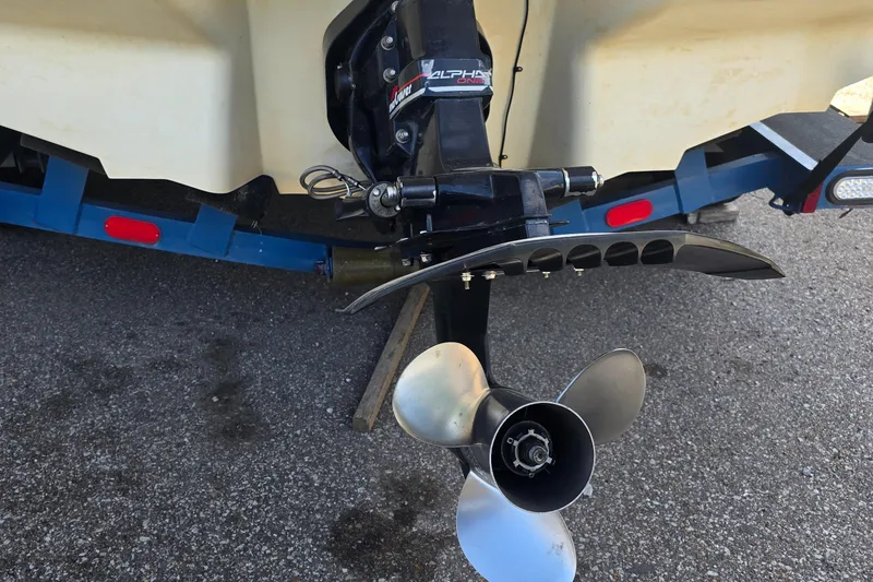 Slide: The Image of 1998 Sea Ray 210br boat propeller and outdrive on a trailer. - 11