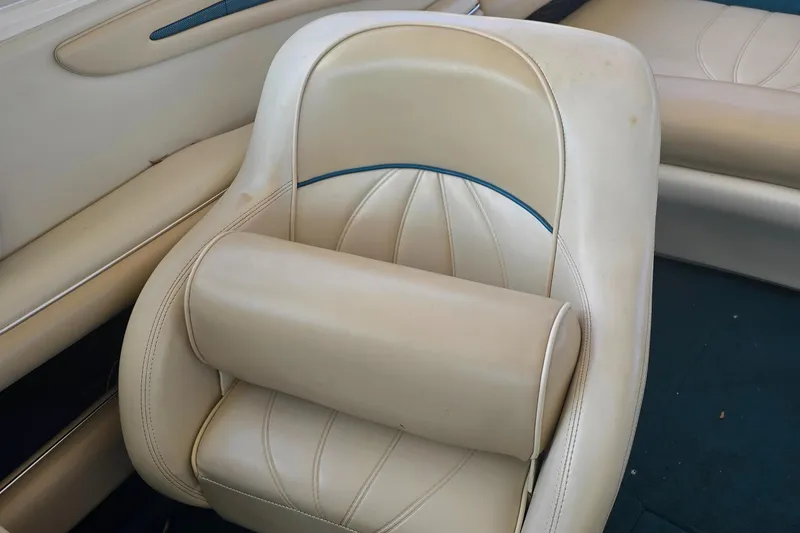 Slide: The Image of Cream leather seat in a 1998 Sea Ray 210br boat interior. - 9