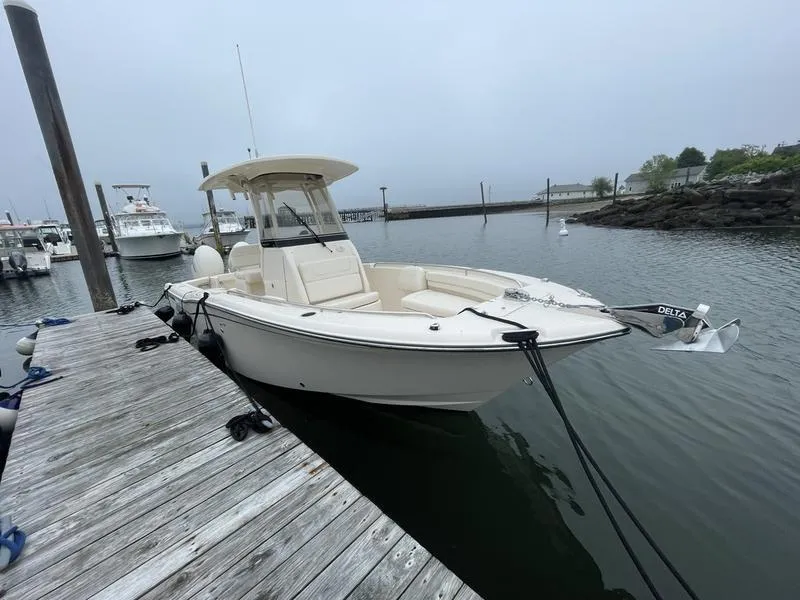 Slide: The Image of 2026 Grady-White 257 Fisherman boat docked at marina on a cloudy day. - 0