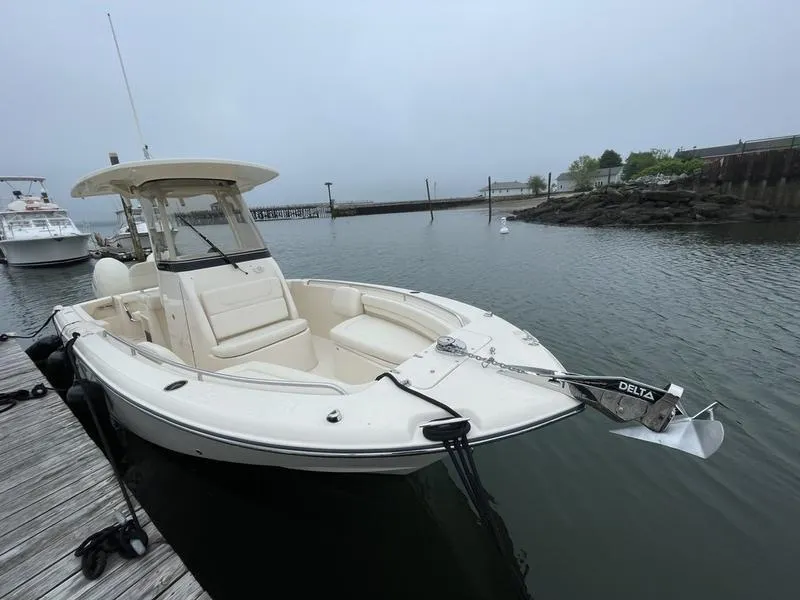 Slide: The Image of 2026 Grady-White 257 Fisherman boat docked in a calm marina. - 1