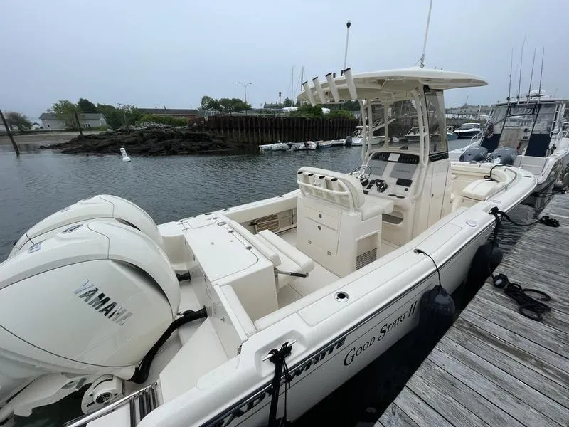 Slide: The Image of 2026 Grady-White 257 Fisherman boat docked, featuring Yamaha engines and spacious deck. - 5