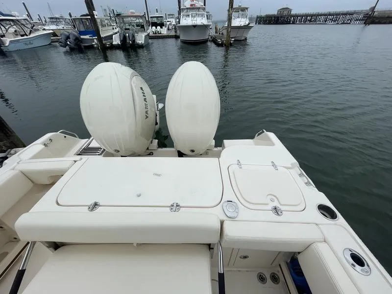 Slide: The Image of 2026 Grady-White 257 Fisherman boat with twin Yamaha engines docked at marina. - 6