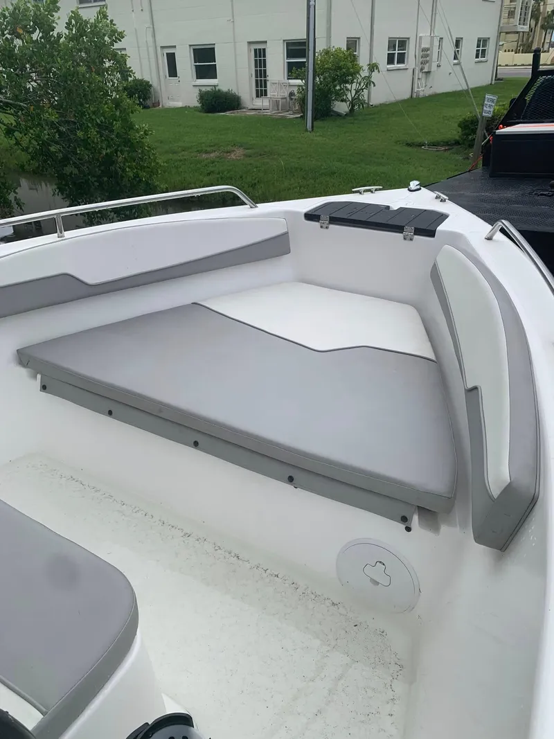Slide: The Image of 2015 Key Largo 180 Center Console boat interior with cushioned seating. - 10
