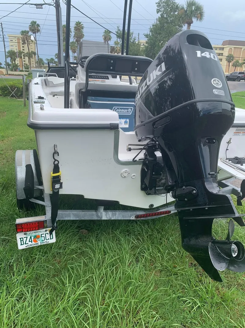 Slide: The Image of 2015 Key Largo 180 Center Console boat with Suzuki 140 outboard motor on trailer. - 16