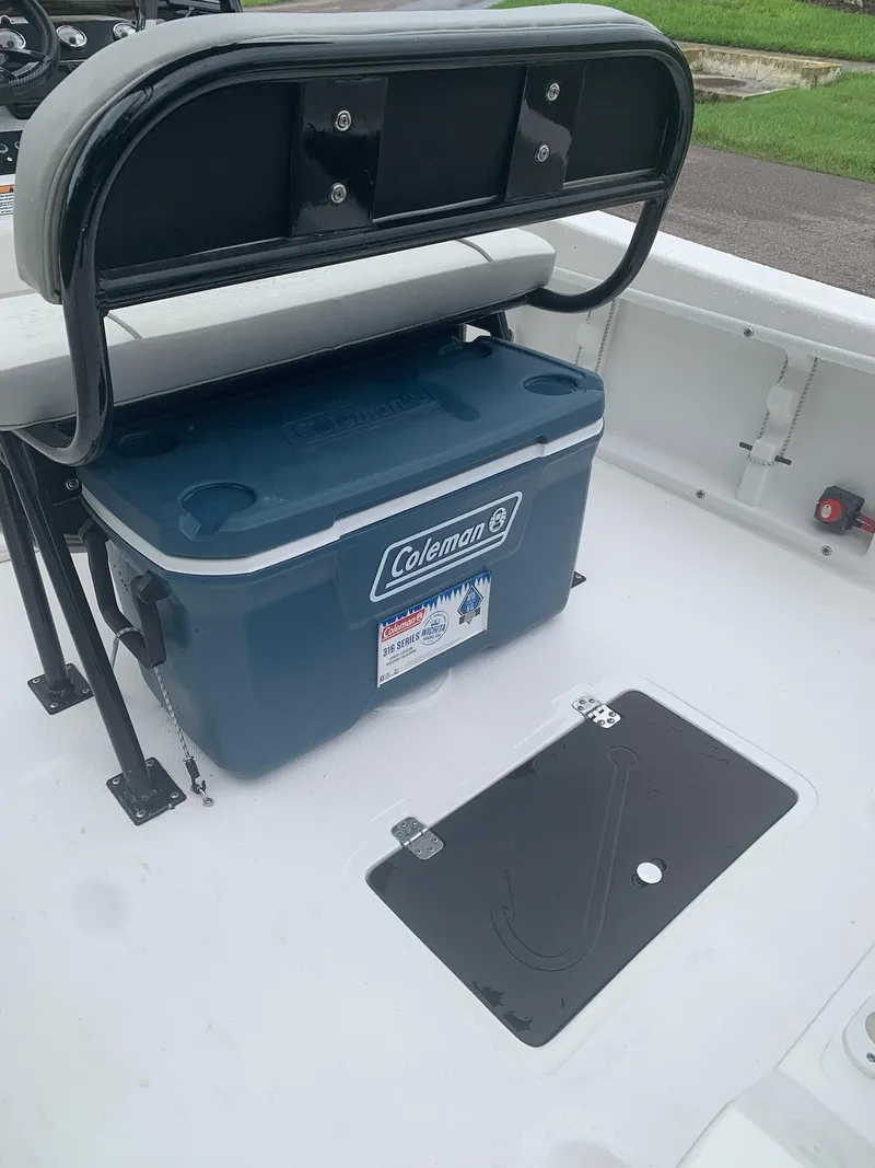 Slide: The Image of 2015 Key Largo 180 Center Console boat with Coleman cooler and seating. - 18