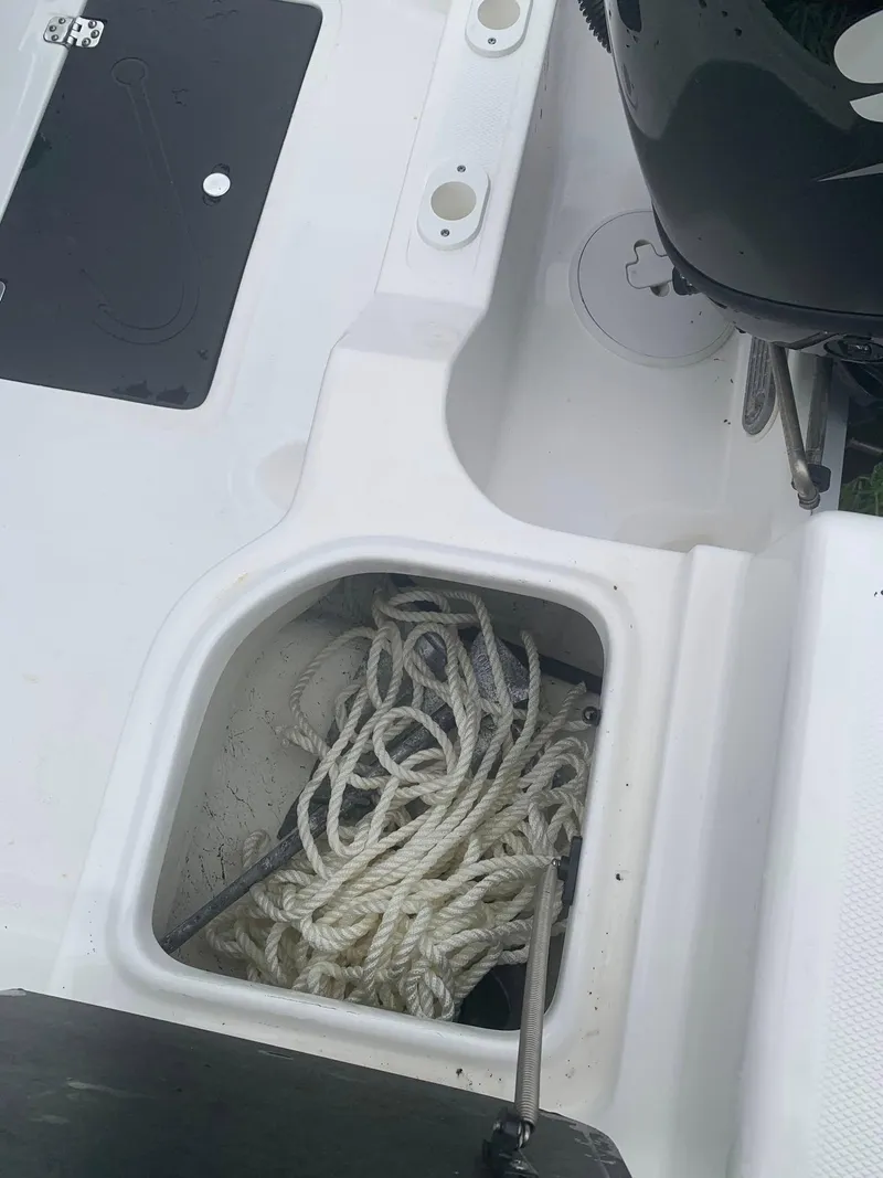 Slide: The Image of 2015 Key Largo 180 Center Console boat with rope storage compartment. - 7