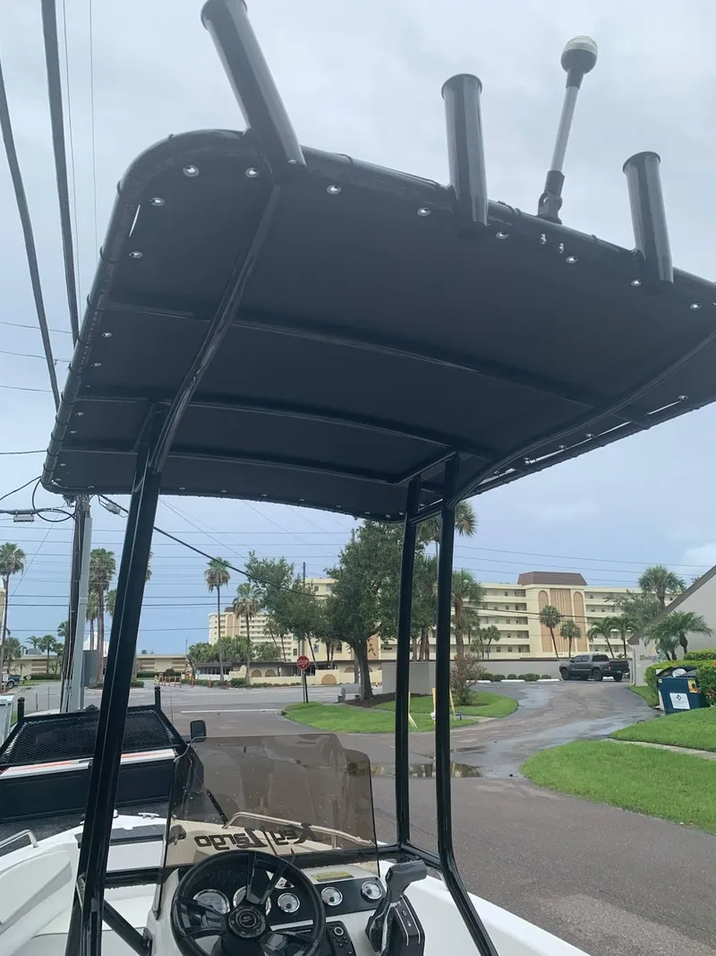 Slide: The Image of 2015 Key Largo 180 Center Console boat with T-top and steering wheel. - 9