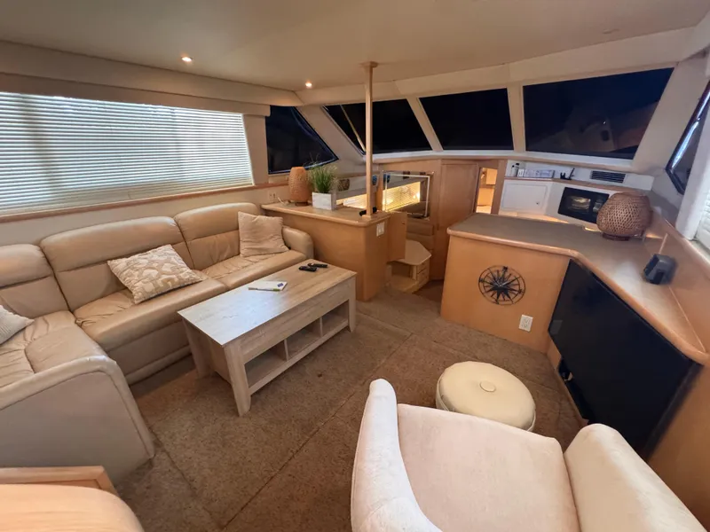 Slide: The Image of Luxurious interior of 1998 Carver 405 Aft Cabin yacht with comfortable seating and modern amenities. - 16