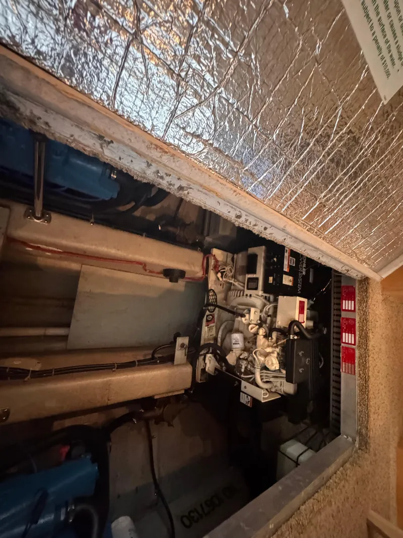 Slide: The Image of Engine room of a 1998 Carver 405 Aft Cabin boat, showing mechanical components. - 17