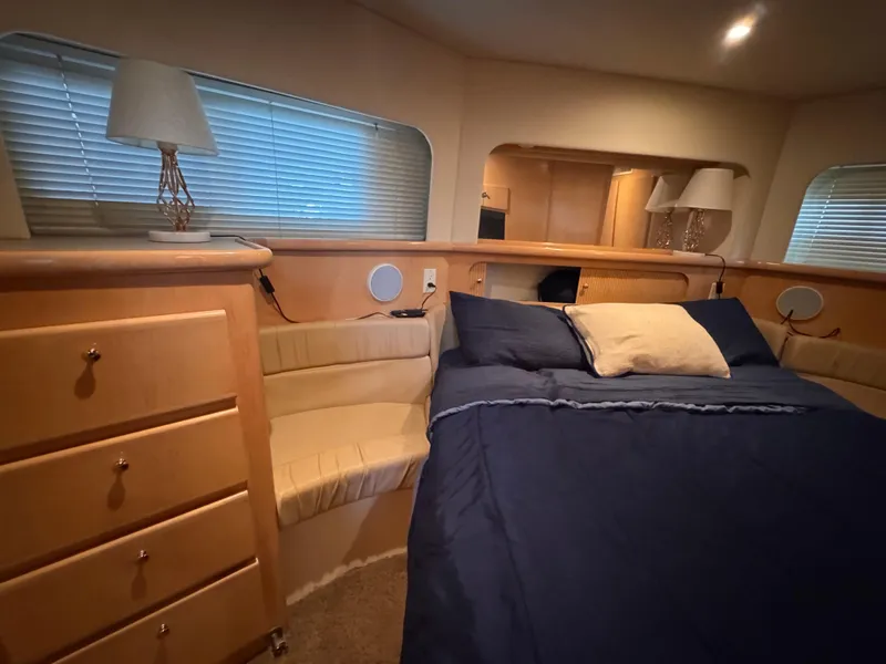 Slide: The Image of Luxurious 1998 Carver 405 Aft Cabin bedroom with cozy bed and elegant decor. - 22