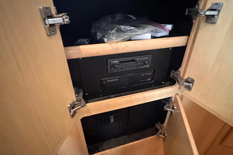 Slide: The Image of 1998 Carver 405 Aft Cabin interior cabinet with Kenwood stereo system. - 37