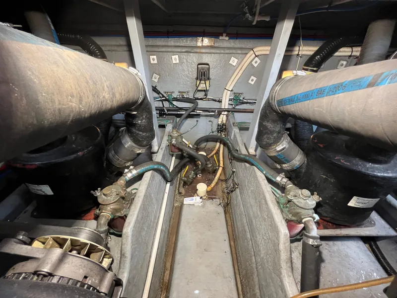 Slide: The Image of Engine room of a 1999 Sea Ray 400 Sundancer with visible hoses and machinery. - 7