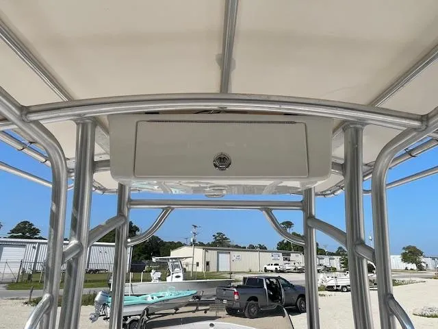 Slide: The Image of 2020 Sportsman 221 Heritage boat with T-top frame and storage compartment. - 10