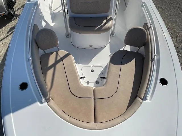 Slide: The Image of 2020 Sportsman 221 Heritage boat with beige seating and spacious deck layout. - 2