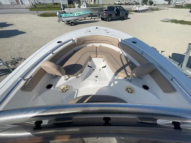 Slide: The Image of 2020 Sportsman 221 Heritage boat with spacious seating and modern design, docked outdoors. - 3