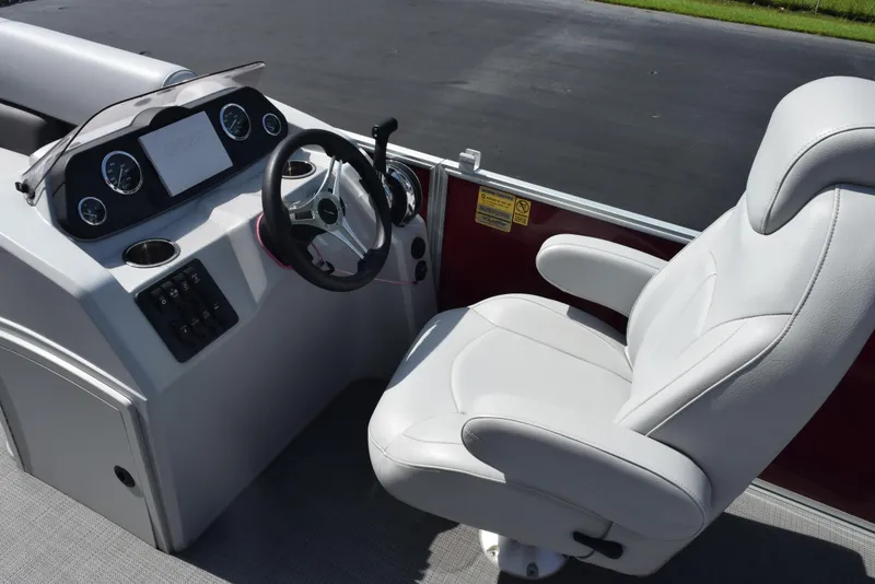 Slide: The Image of 2022 Bentley Pontoons 220 Fish N Cruise helm with white captain's chair and dashboard. - 10