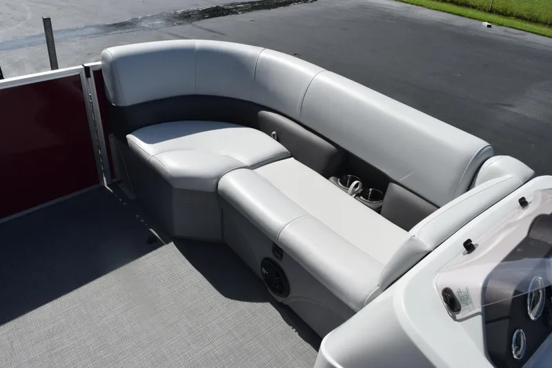 Slide: The Image of 2022 Bentley Pontoons 220 Fish N Cruise interior with gray seating and cup holders. - 11