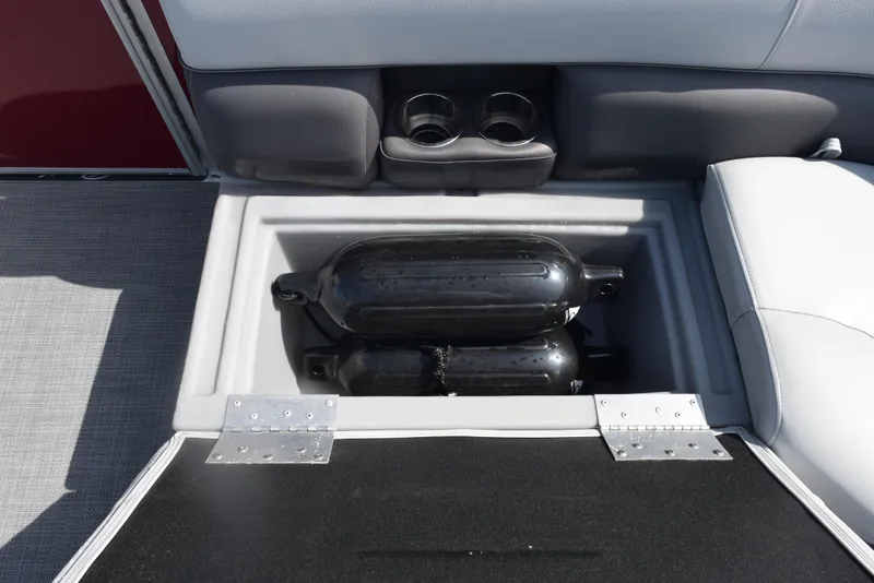 Slide: The Image of 2022 Bentley Pontoons 220 Fish N Cruise storage compartment with black fenders and cup holders. - 14