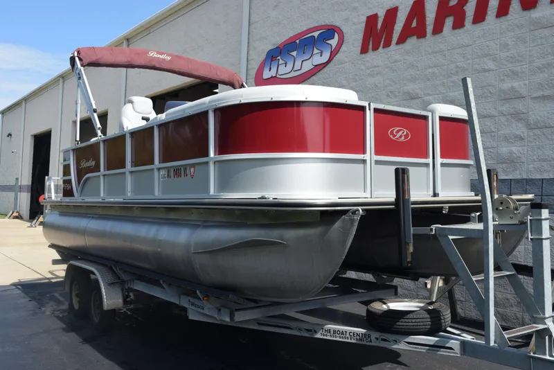 Slide: The Image of 2022 Bentley Pontoons 220 Fish N Cruise on trailer outside marine shop. - 2