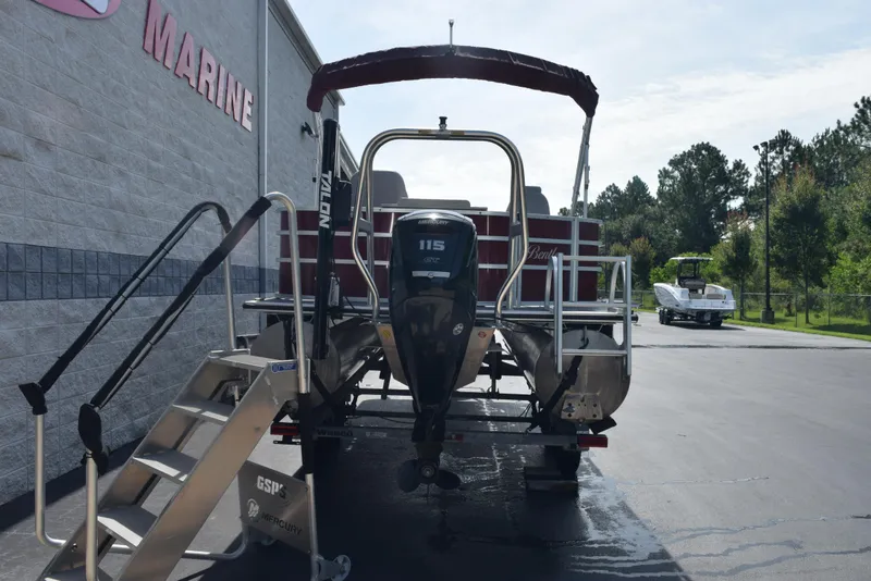Slide: The Image of 2022 Bentley Pontoons 220 Fish N Cruise with Mercury outboard motor at a marine dealership. - 5