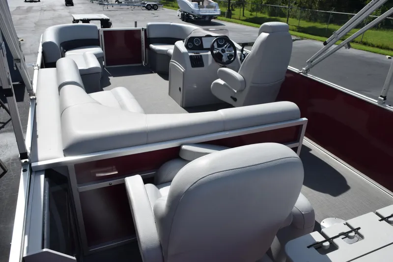 Slide: The Image of 2022 Bentley Pontoons 220 Fish N Cruise interior with plush seating and steering console. - 7