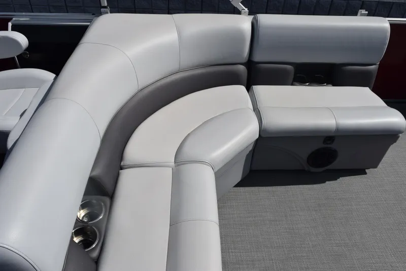 Slide: The Image of 2022 Bentley Pontoons 220 Fish N Cruise interior seating with cup holders and speaker. - 9