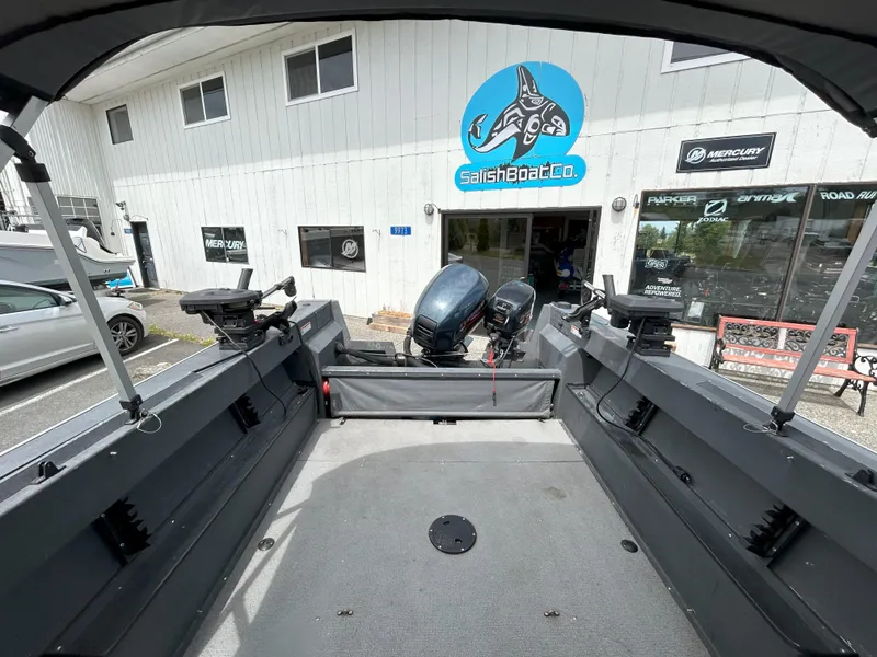 Slide: The Image of 1999 Hewescraft Sea Runner 179 boat at Salish Boat Co. with outboard motors. - 13